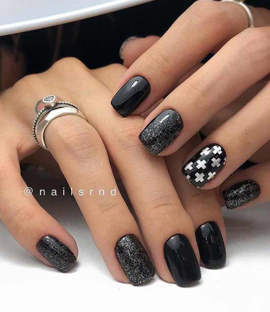 Black manicure with sequins and white print