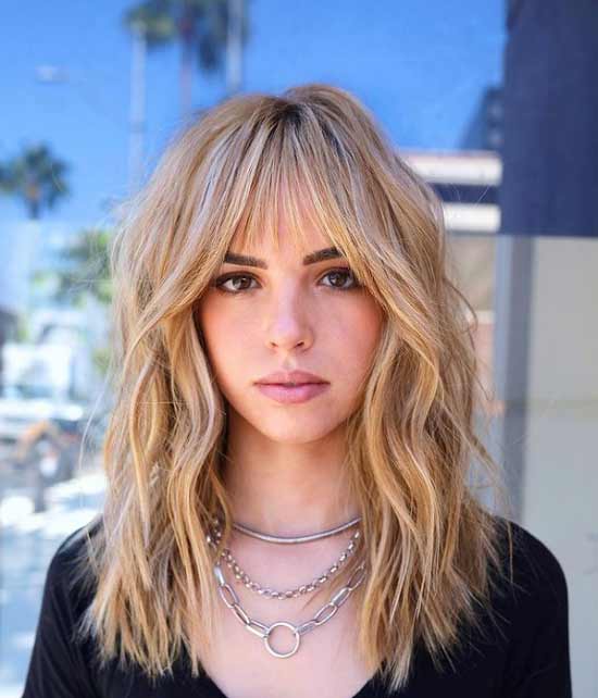 Long blonde hair with bangs