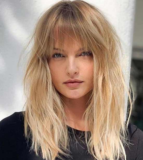 Fashionable haircut and styling for long hair with bangs