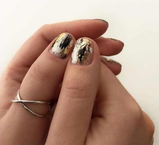 Winter manicure with golden decor