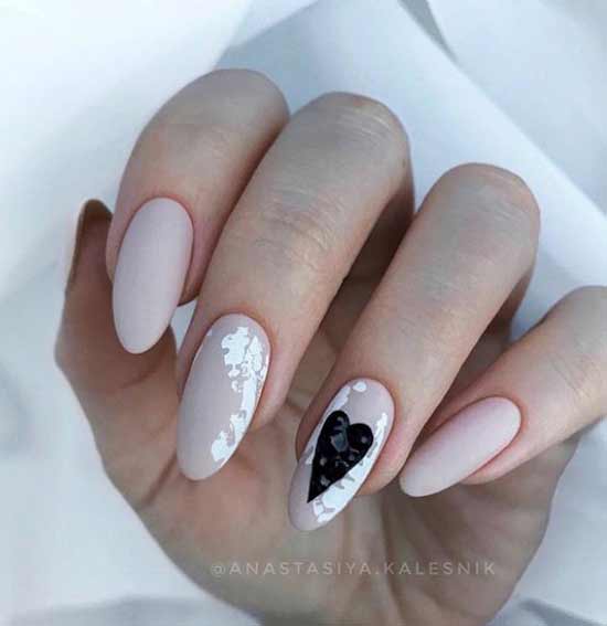 Delicate manicure with a heart pattern