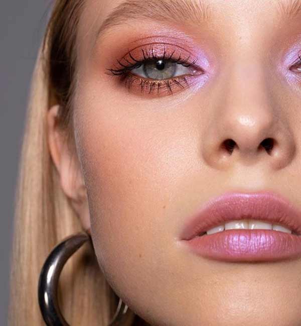 Fashionable makeup with pink accents