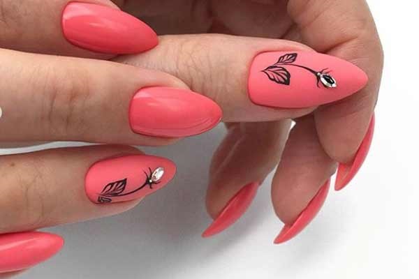 Coral color manicure with spring pattern