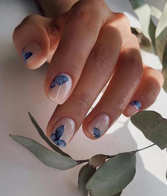 Spring manicure with blue flowers