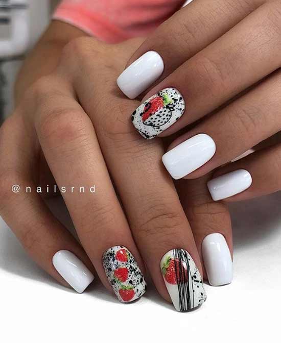 White manicure with berries