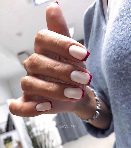 French manicure in red tones