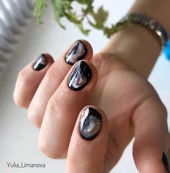 Black manicure with abstraction