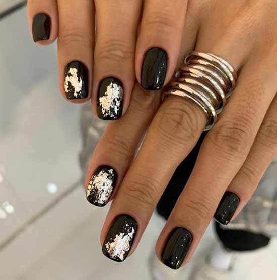 Black manicure with foil