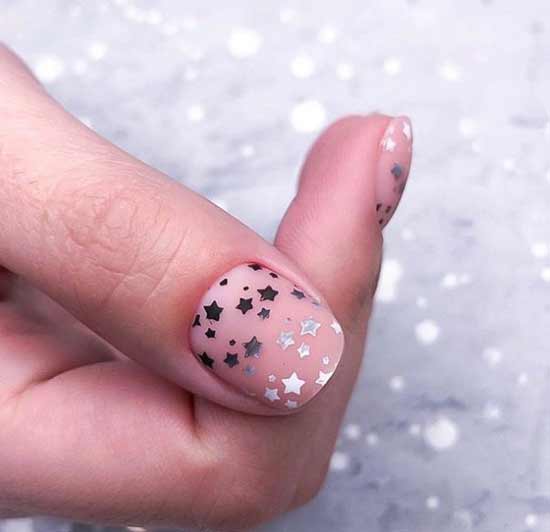 Semi-transparent manicure with asterisks