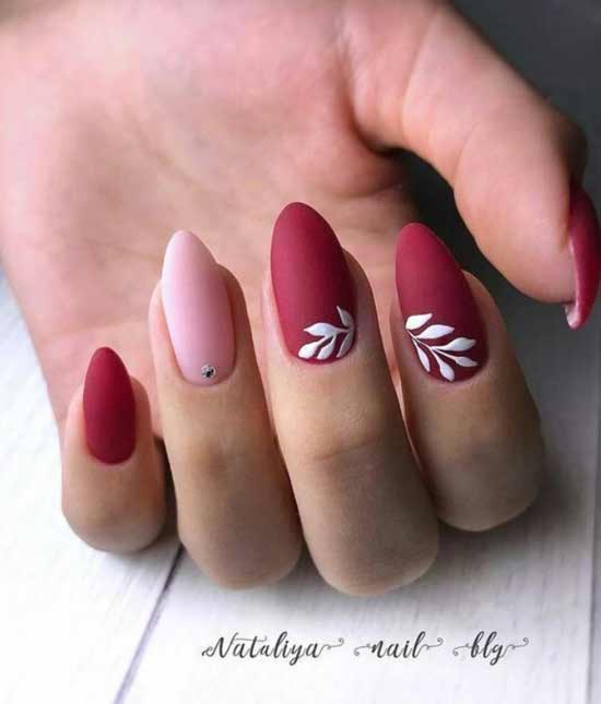 Drawing on a red background of nails