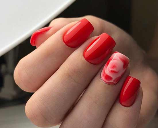 Red manicure with a flower