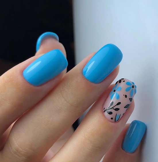 Blue manicure with a flower to match