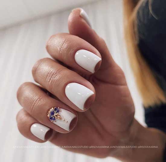 White manicure with rhinestones