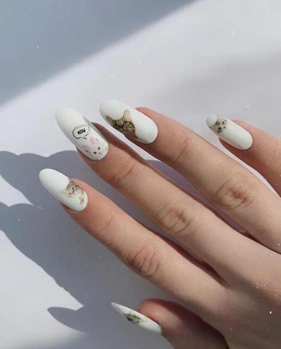 White nail design with lettering