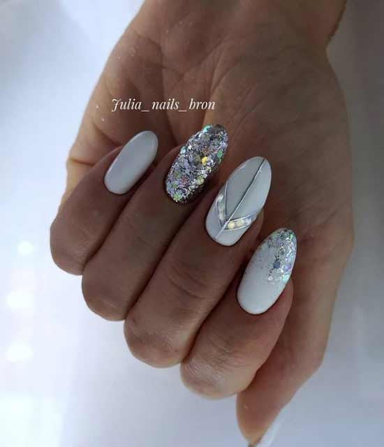 White manicure with rhinestones and sparkles