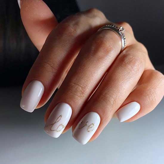 White manicure with the inscription love