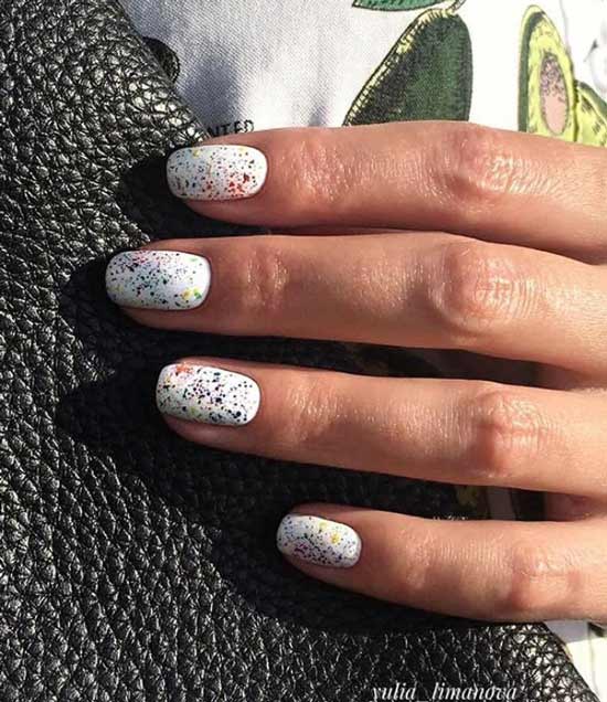 White manicure with colored sequins