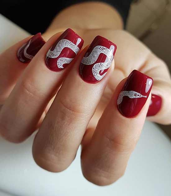 Burgundy manicure white snake