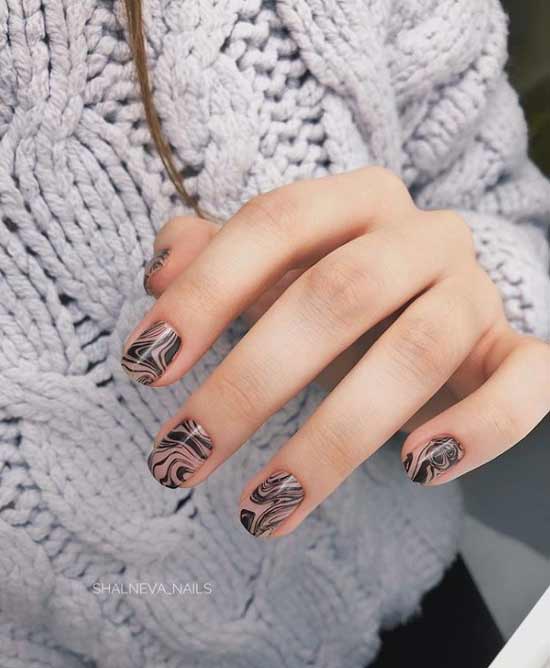 Fashionable beige manicure with black photo