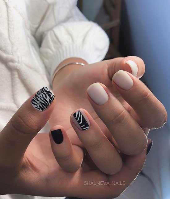 Beige manicure with black print