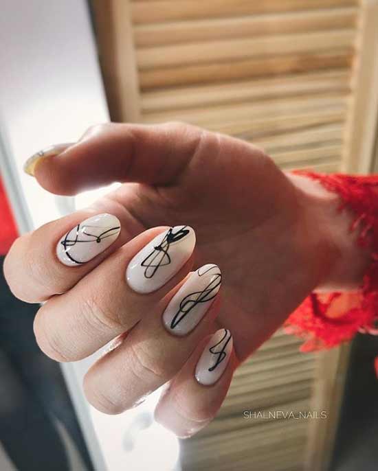 Manicure beige with black and pattern