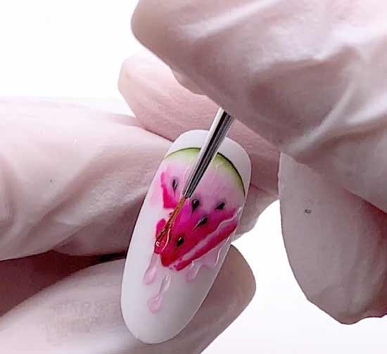 Drawing on the nails of watermelon slices