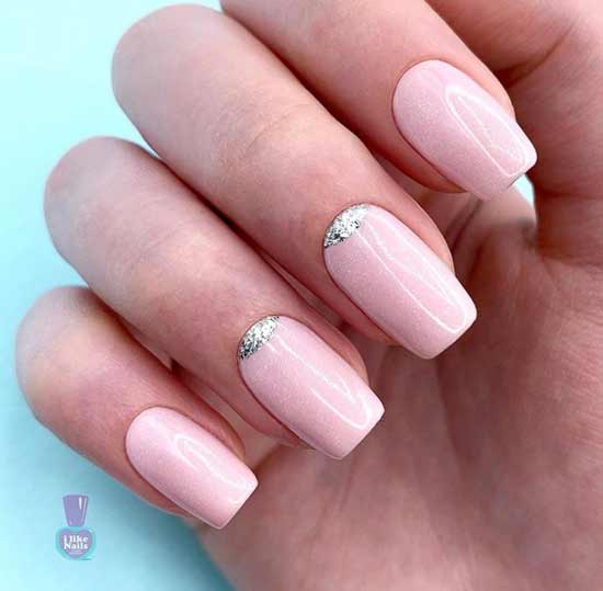 Delicate manicure with glitter accent on the cuticle