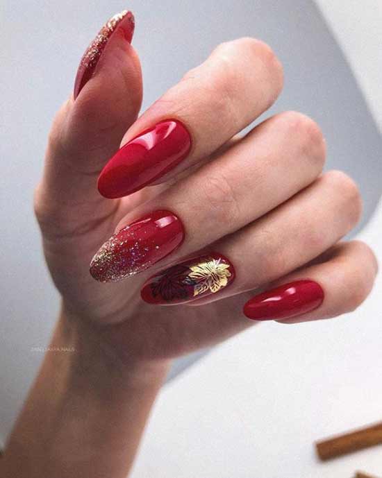 Red manicure with gold accents