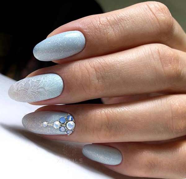 Blue New Year's manicure with rhinestones