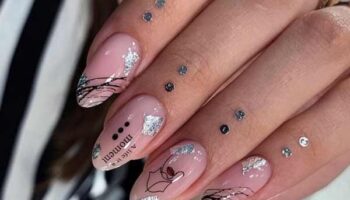 Nude manicure with spiderweb