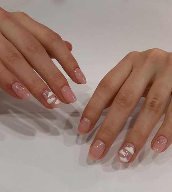 Beige manicure with clouds