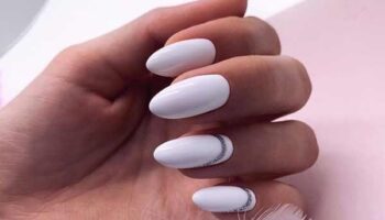 Beautiful white manicure with decor