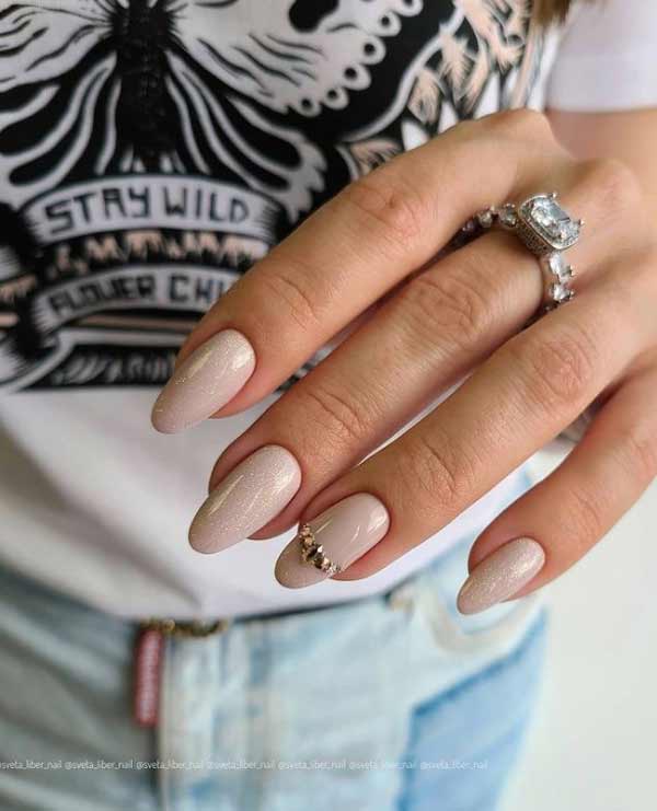 Beautiful beige glitter manicure