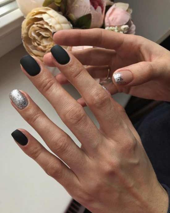 Black glitter manicure on ring finger