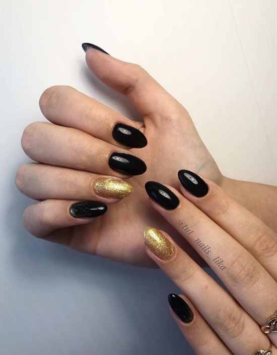 Black manicure with gold sequins