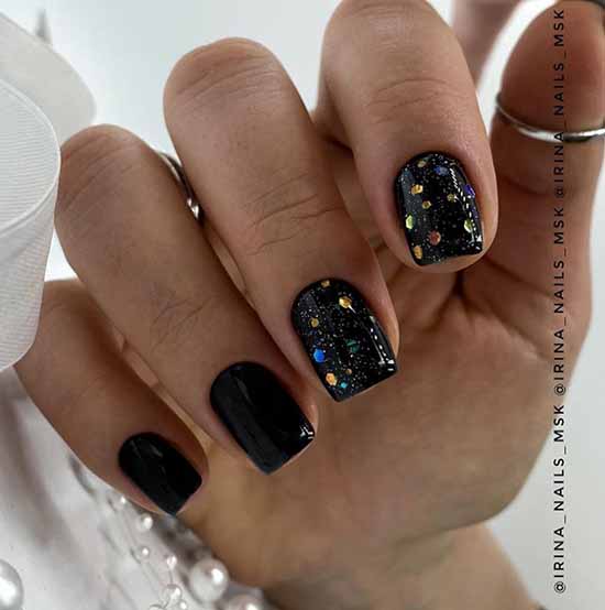 Black manicure with multi-colored sequins