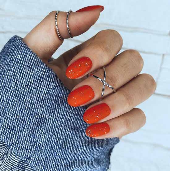 Matte glitter color of the manicure carrot