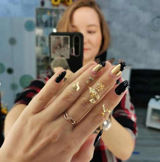 Black and white manicure with gold leaf