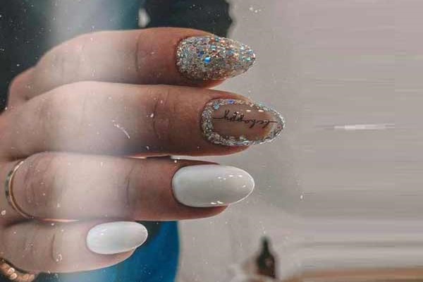 White manicure with sparkles for the new year