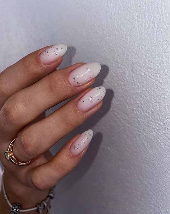 Delicate milky silver glitter manicure