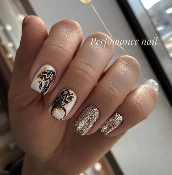 White manicure with sparkles in gold