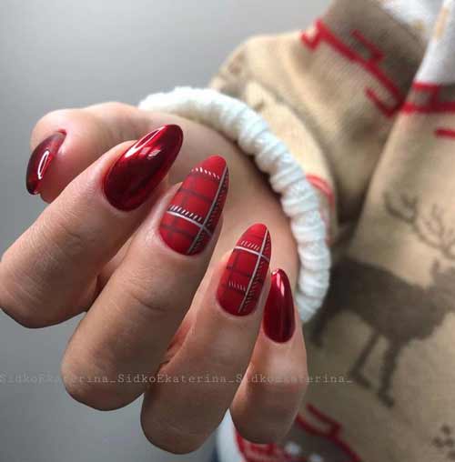 Cage rouge et noire sur les ongles