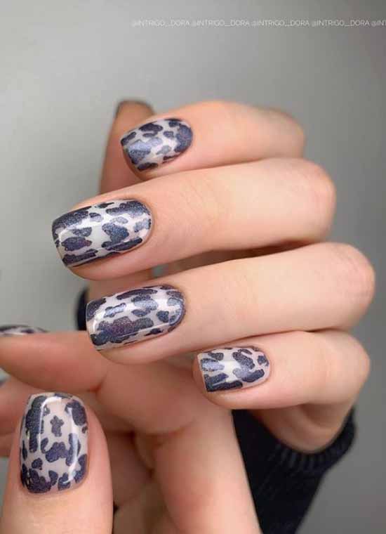 Fashionable manicure with black spots