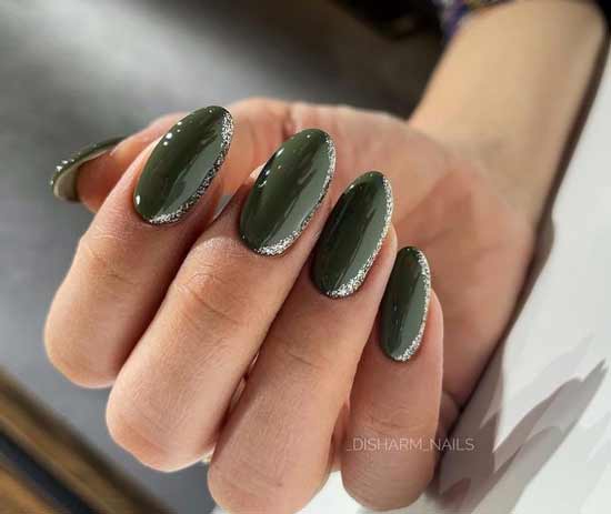 Green manicure with shiny decor