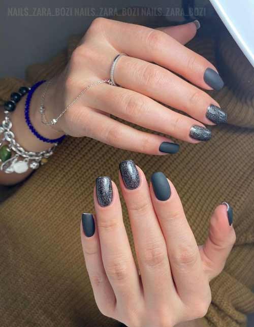 Matte black manicure and silver cat's eye