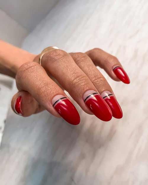 Red manicure with transparent holes