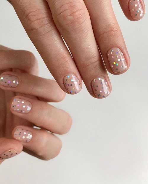 Glitter manicure on transparent space