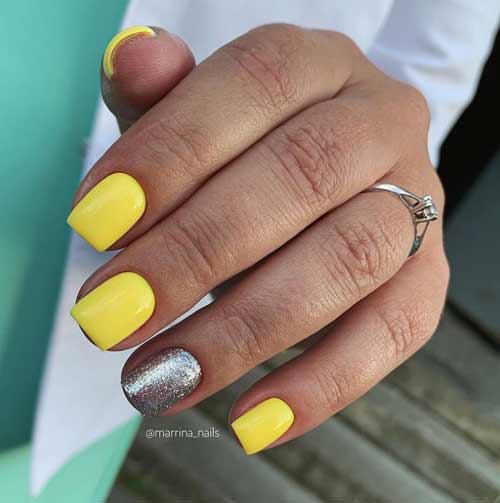 Bright yellow glitter manicure