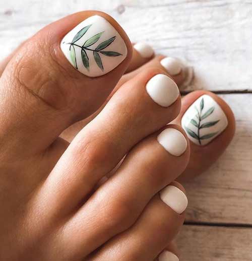 White pedicure with green sprig