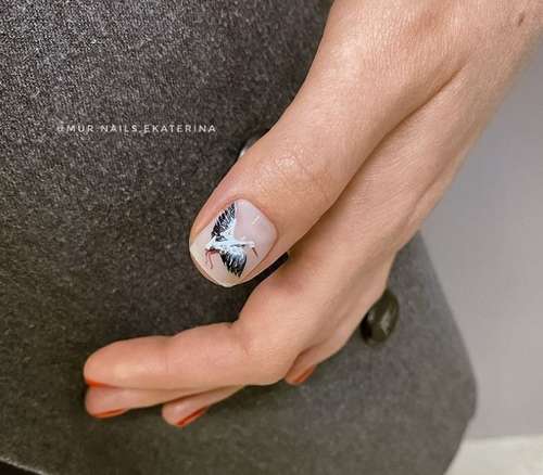 Drawing a bird on one nail